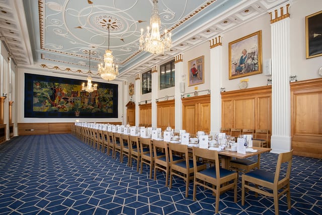 Elegant Great Hall with banquet table, ideal for corporate meetings and formal events.