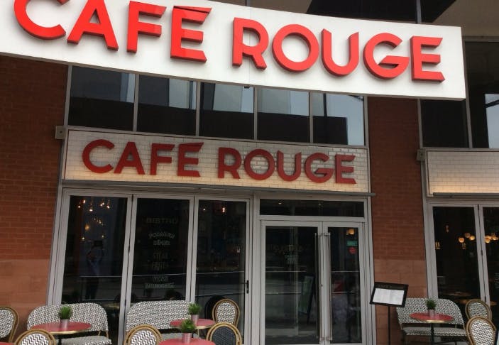 Café Rouge Coventry entrance with outdoor seating, ideal for casual meetings and networking.