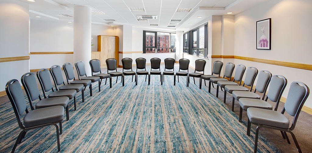 Meeting Room 1 at Jurys Inn Liverpool, featuring a circular chair layout for workshops.