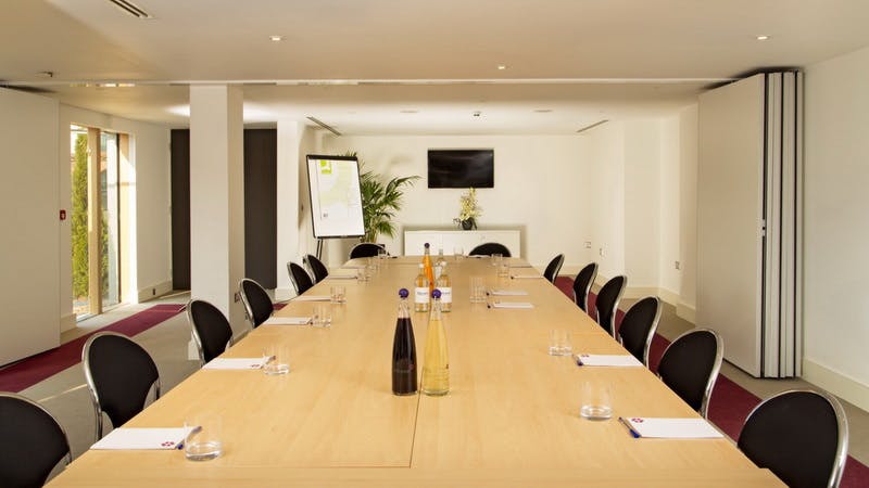 Meeting room at Lifehouse Spa with long table, ideal for corporate events and presentations.