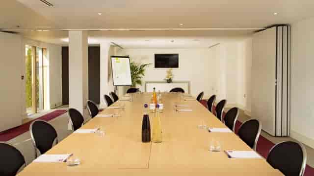 Meeting room at Lifehouse Spa with long table, ideal for corporate events and presentations.