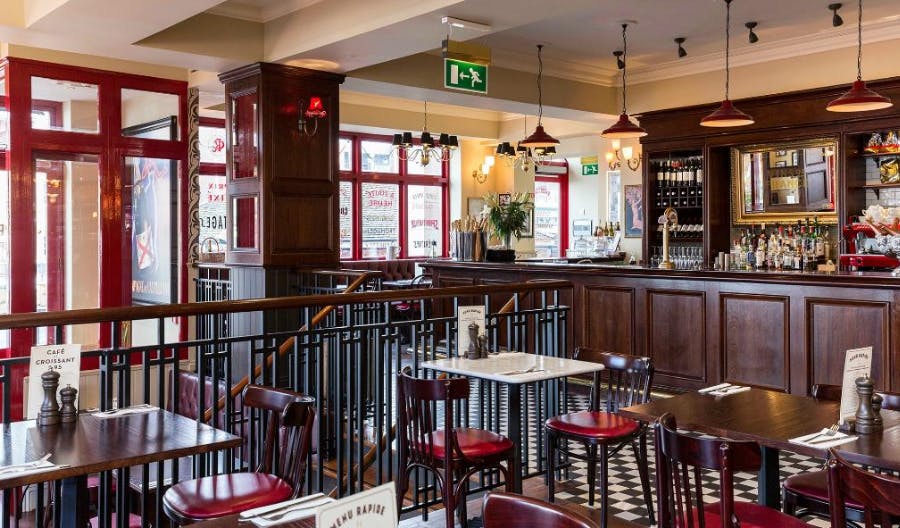 Stylish Café Rouge Portsmouth venue with warm lighting for intimate meetings and events.