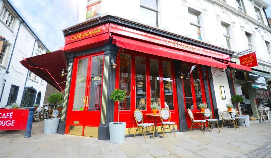 Café Rouge Reigate: vibrant red venue with outdoor seating for networking events.