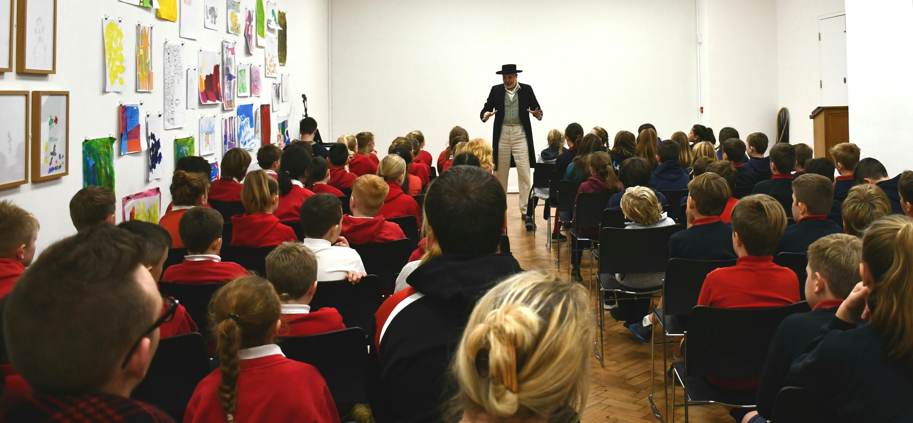 Lecture Theatre at Glynn Vivian Art Gallery with engaging speaker for educational event.