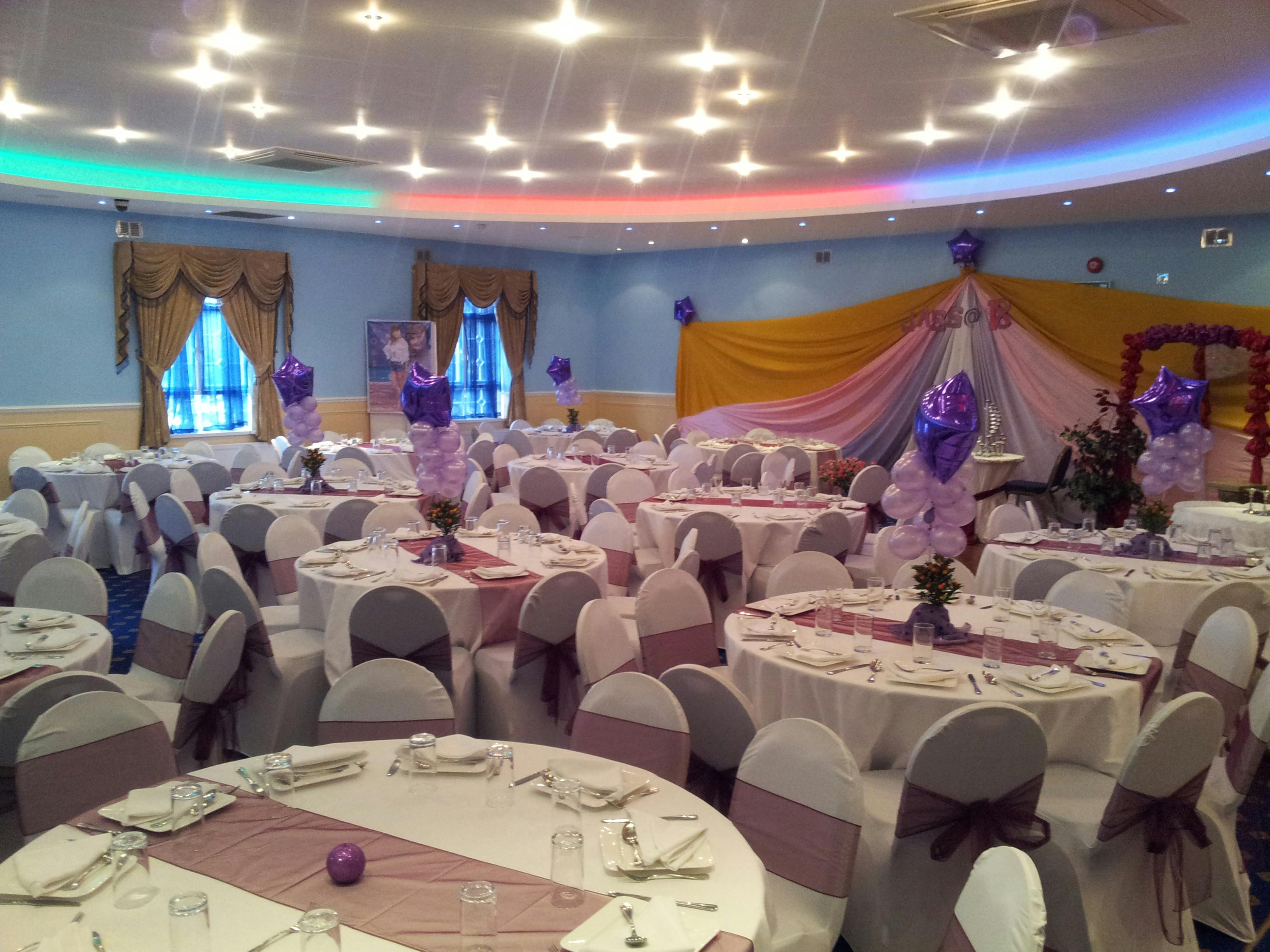 Elegant Banqueting Hall with round tables, perfect for weddings and celebrations.