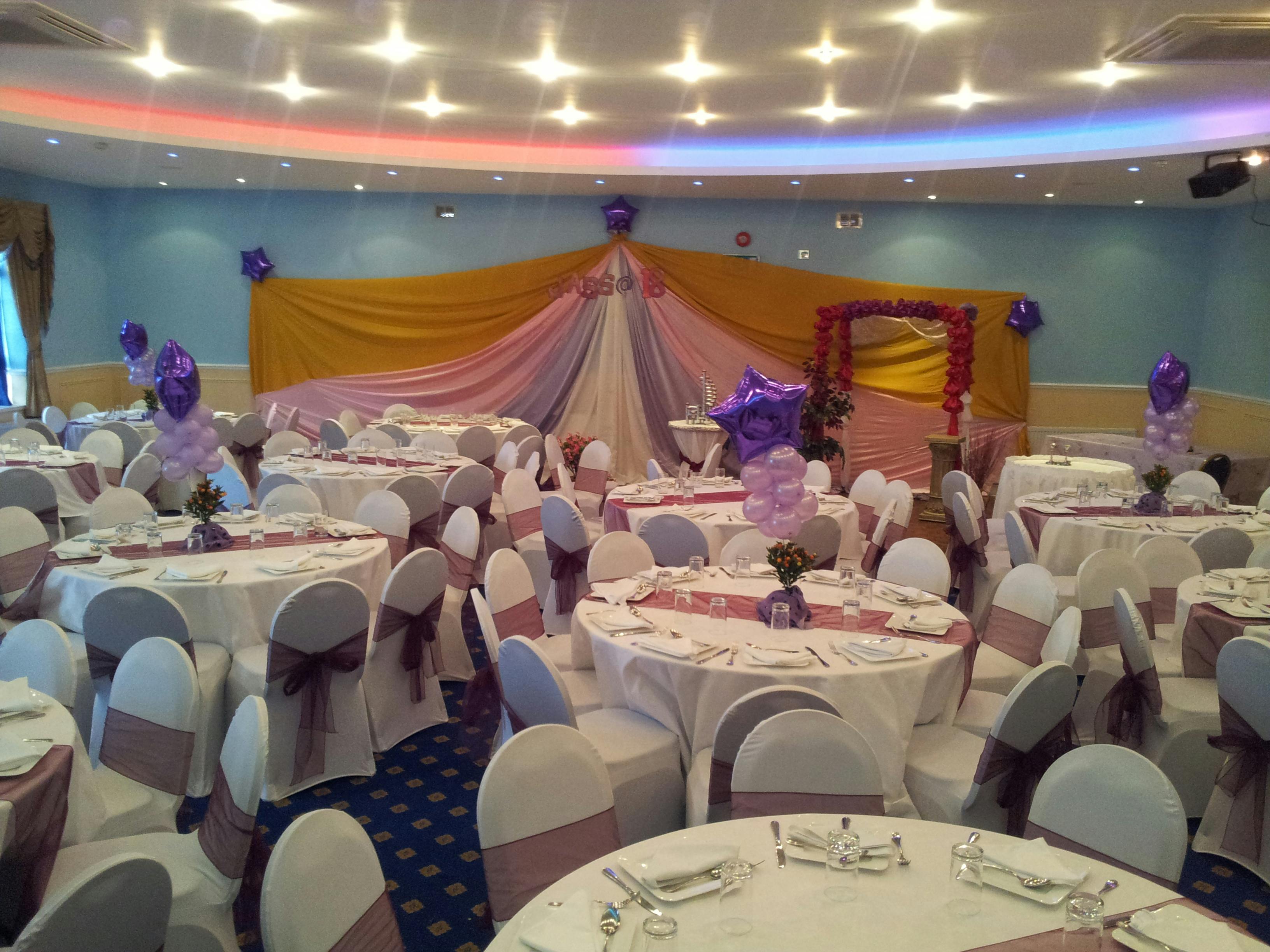 Elegant Banqueting Hall with round tables, perfect for weddings and formal events.