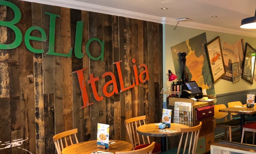 Cozy Bella Italia venue with rustic decor, perfect for networking events and team lunches.