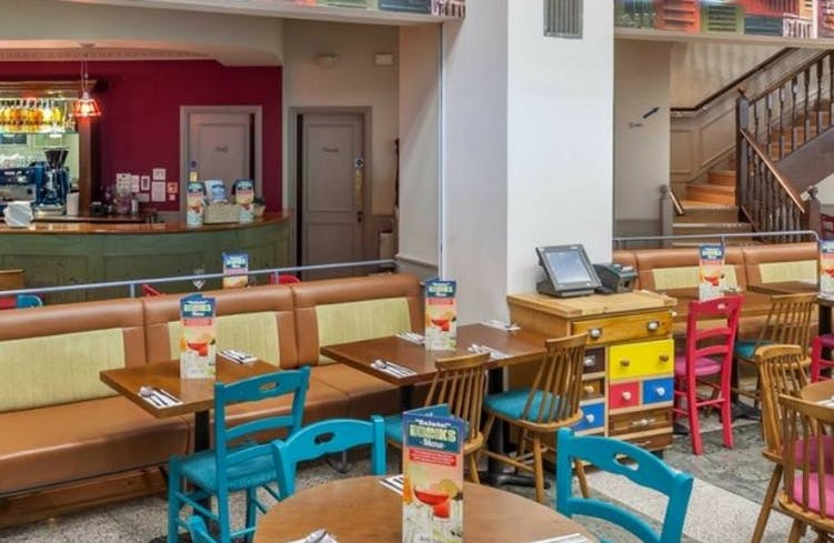 Vibrant dining space at Bella Italia Manchester for casual meetings and networking events.