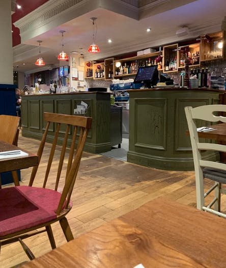 Cozy bar area in Bella Italia Manchester Piccadilly for casual gatherings and networking.