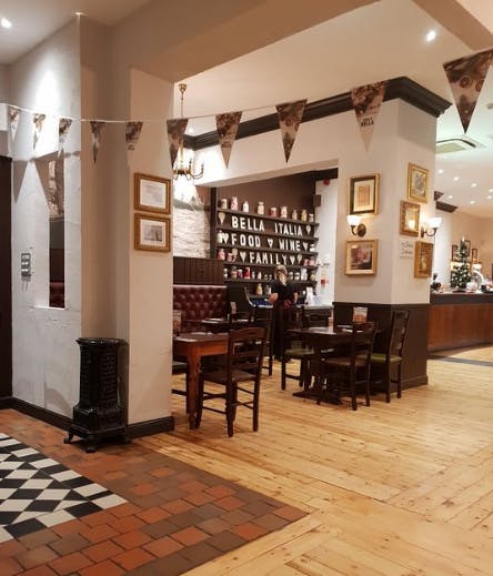 Cozy Bella Italia Cardiff Bay venue with warm decor, perfect for intimate events and gatherings.