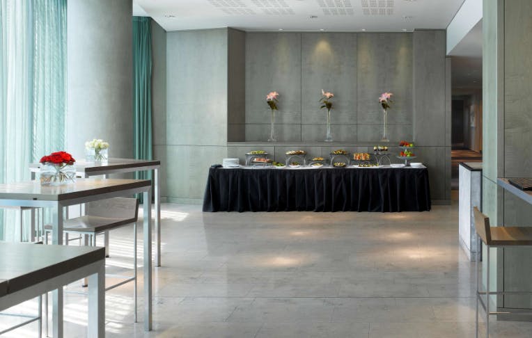 Lunar Suite at Radisson Blu Birmingham: modern event space with elegant decor and buffet.