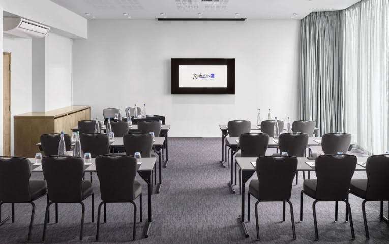 Water Suite at Radisson Blu Birmingham, modern meeting room for corporate events and training.