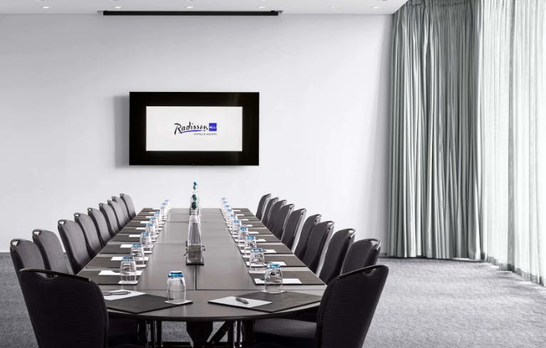 Modern conference room in Radisson Blu Birmingham, ideal for corporate meetings and presentations.