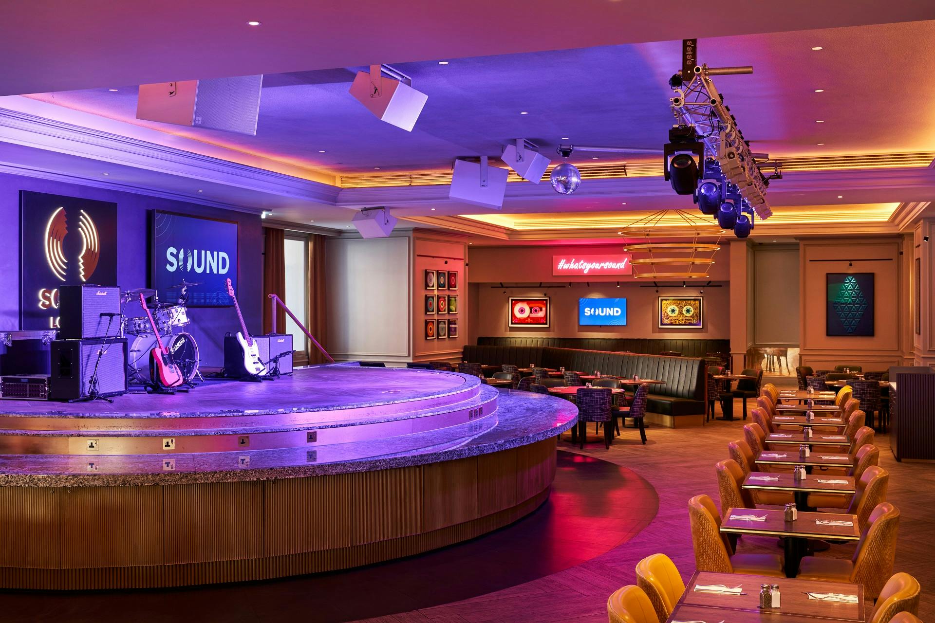Versatile event space with stage for concerts and gatherings at Cafe Exclusive.