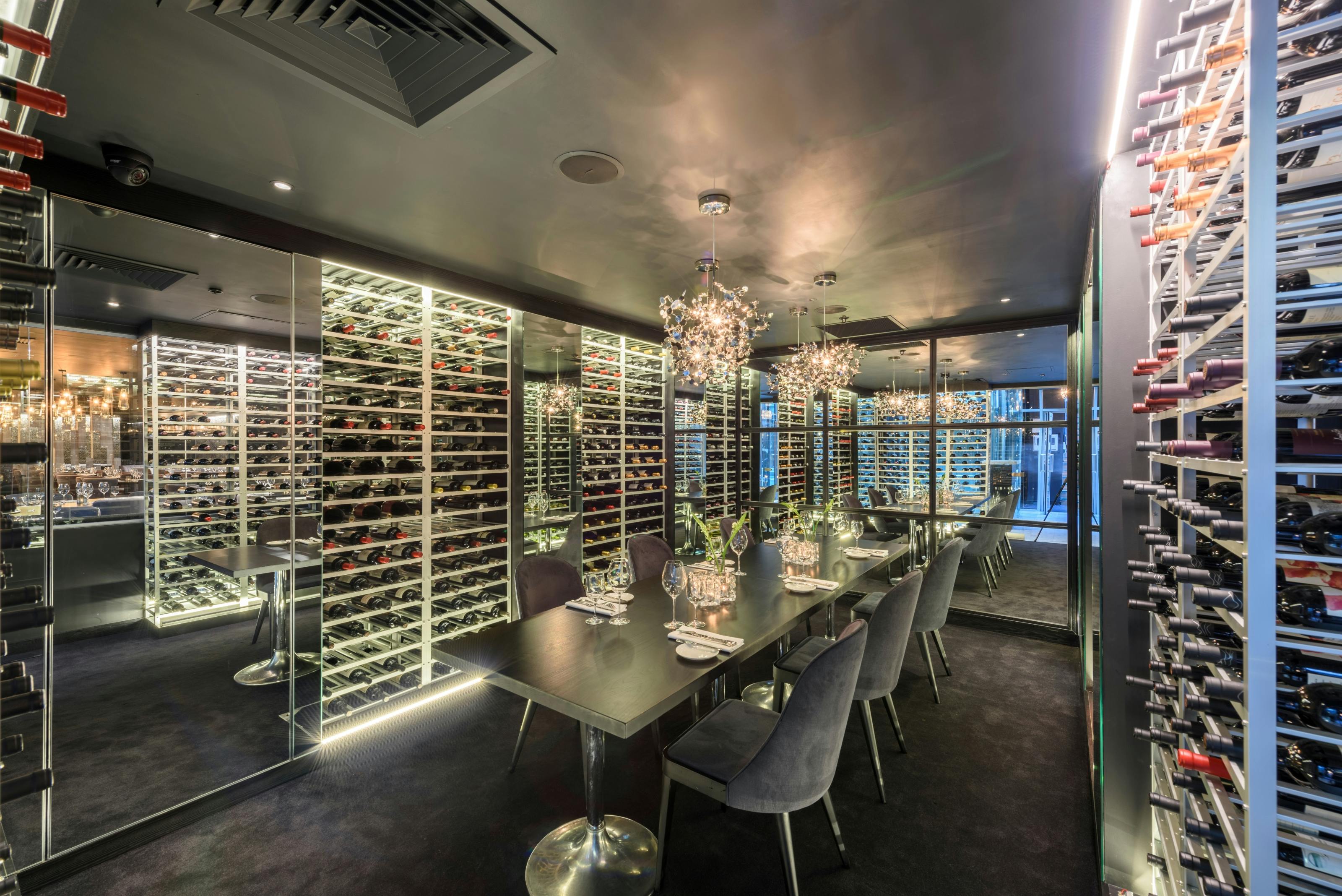 Sophisticated wine room with modern display for exclusive meetings and intimate events.