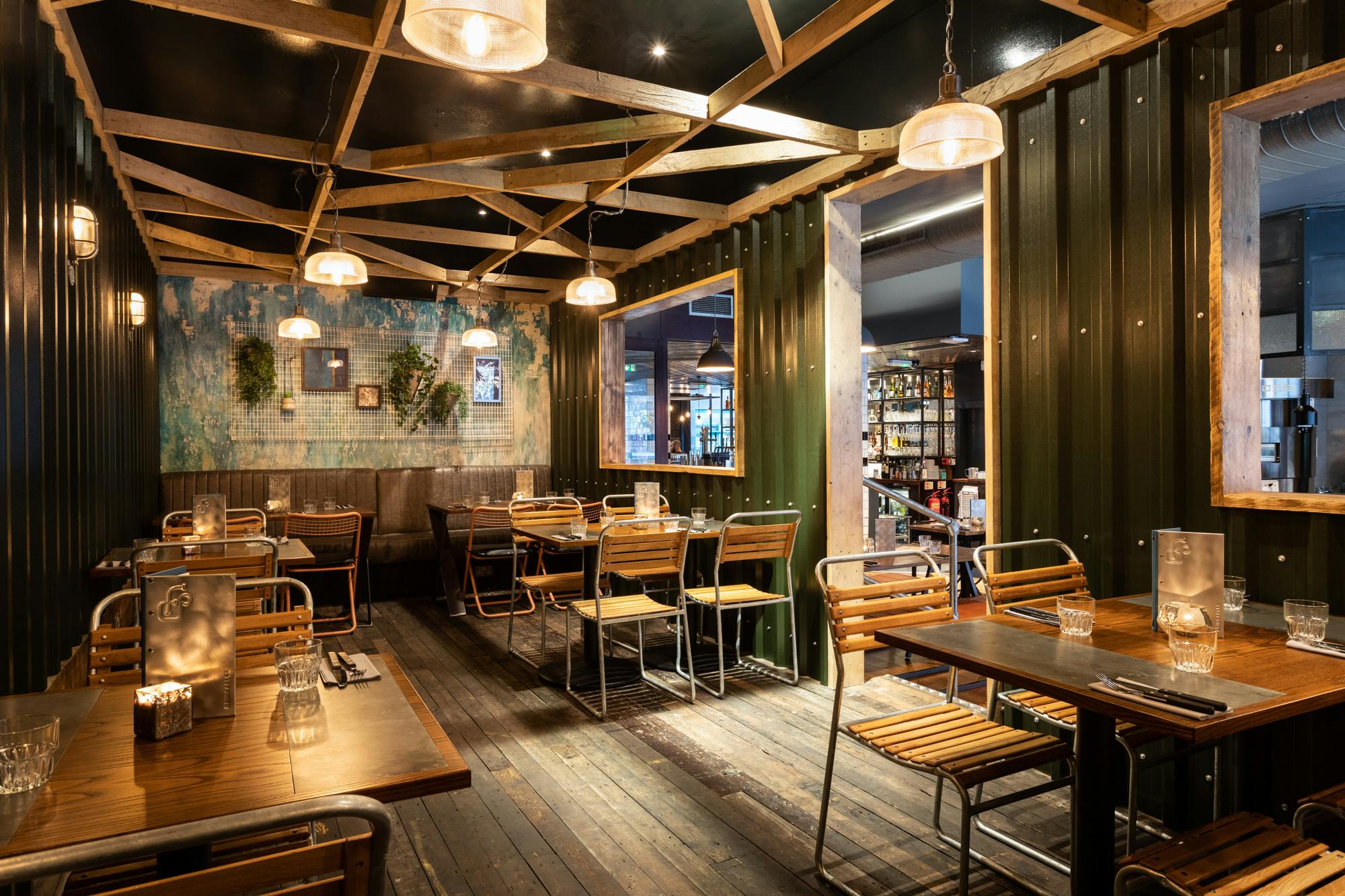 Stylish restaurant space with warm lighting, ideal for intimate meetings and events.