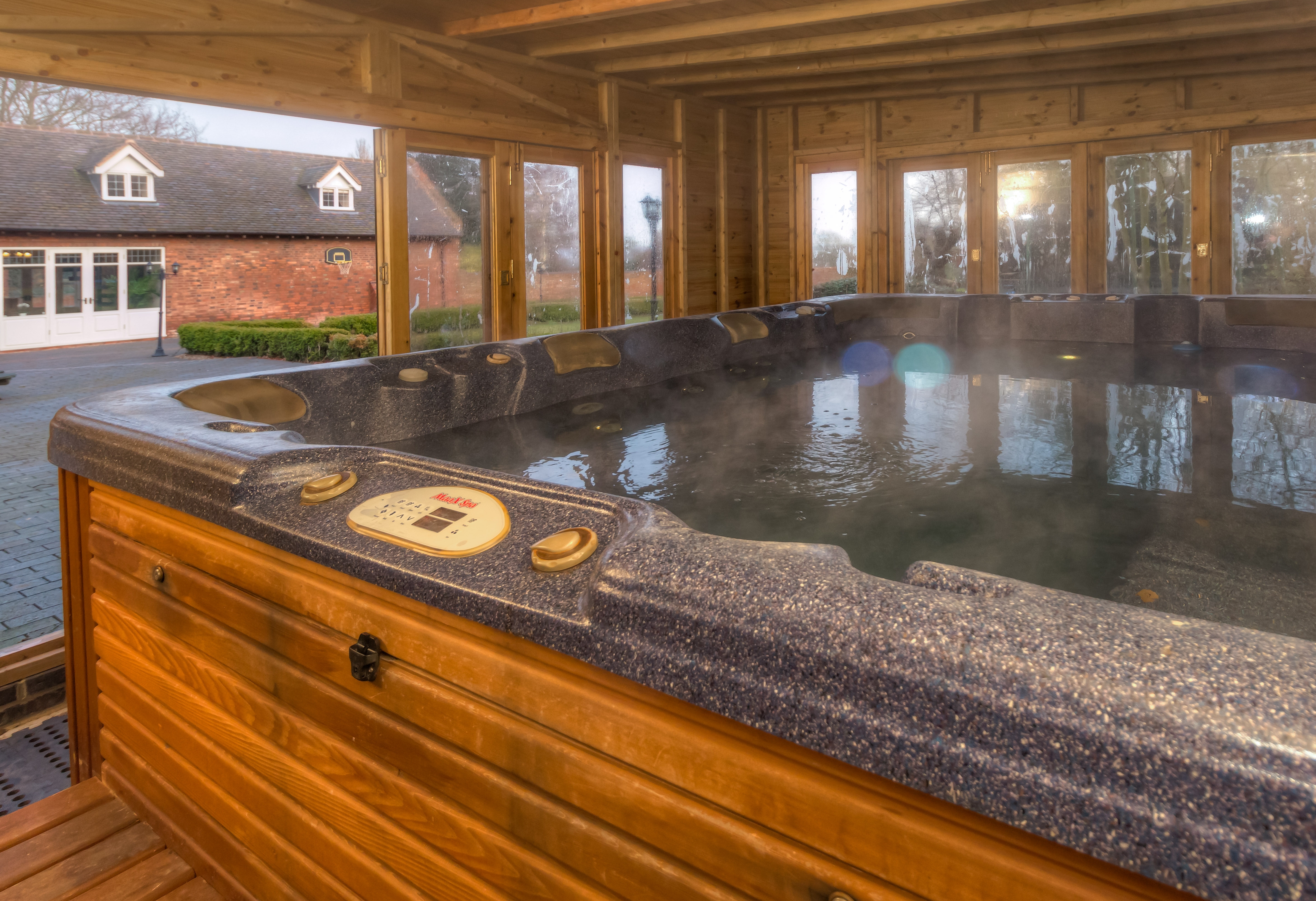 Luxurious hot tub in private estate, perfect for retreats and team-building events. - Banner