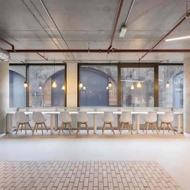 Modern reception area with sleek table, ideal for workshops and meetings in Battersea.