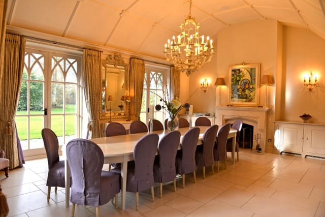 Elegant reception hall in Foxlea Manor with a long dining table for meetings and events.