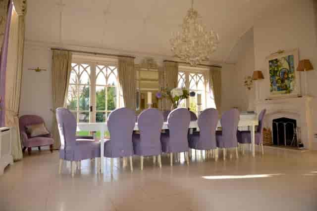 Elegant reception hall with long table, ideal for meetings or gatherings at Foxlea Manor.