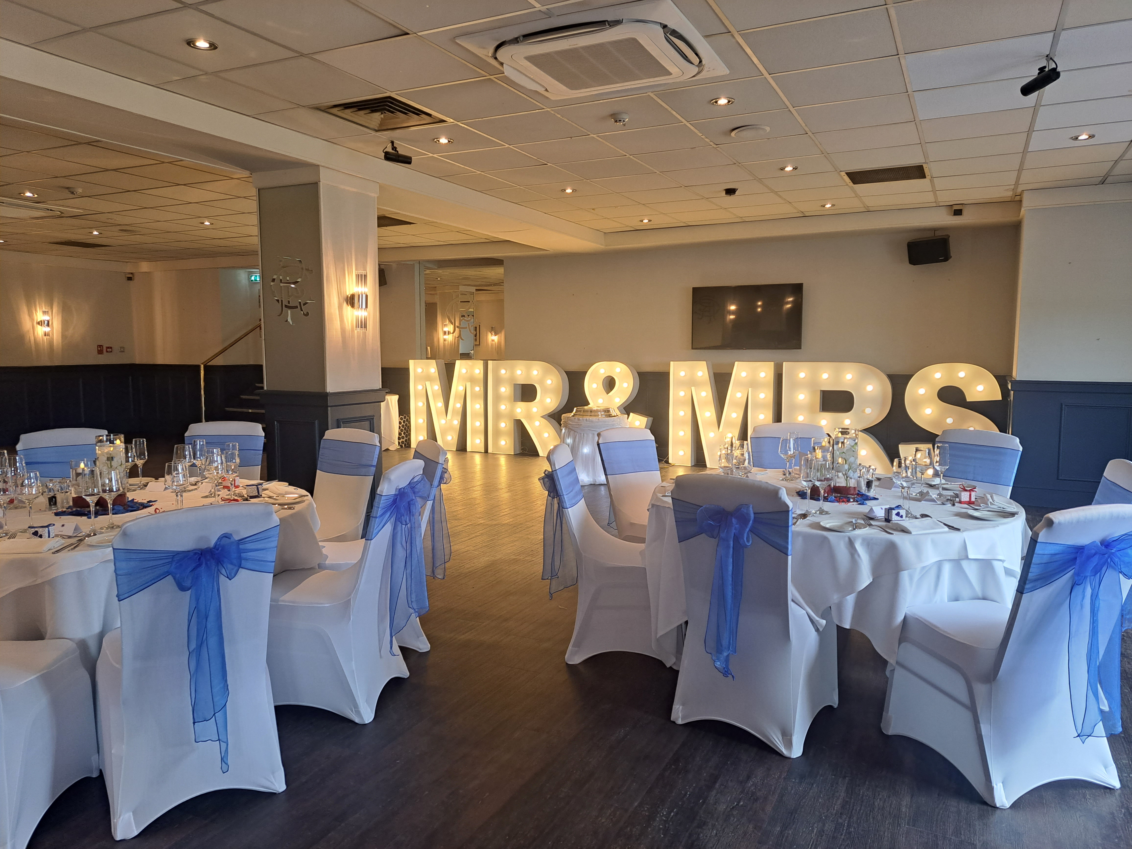 Elegant Thornton Suite at Rangers FC, perfect for wedding receptions with stunning decor. - Banner