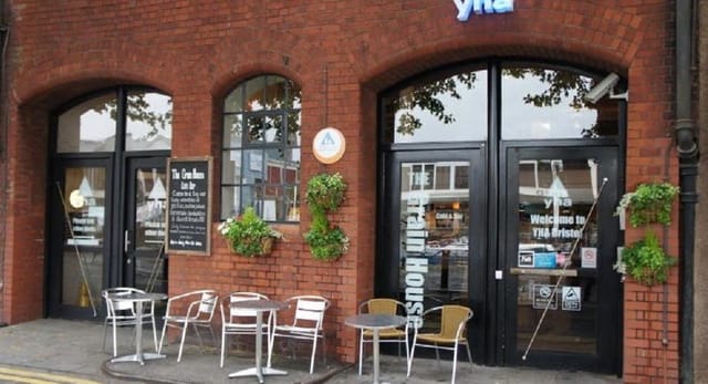 Welcoming YHA meeting room entrance with brick facade, ideal for events and networking.