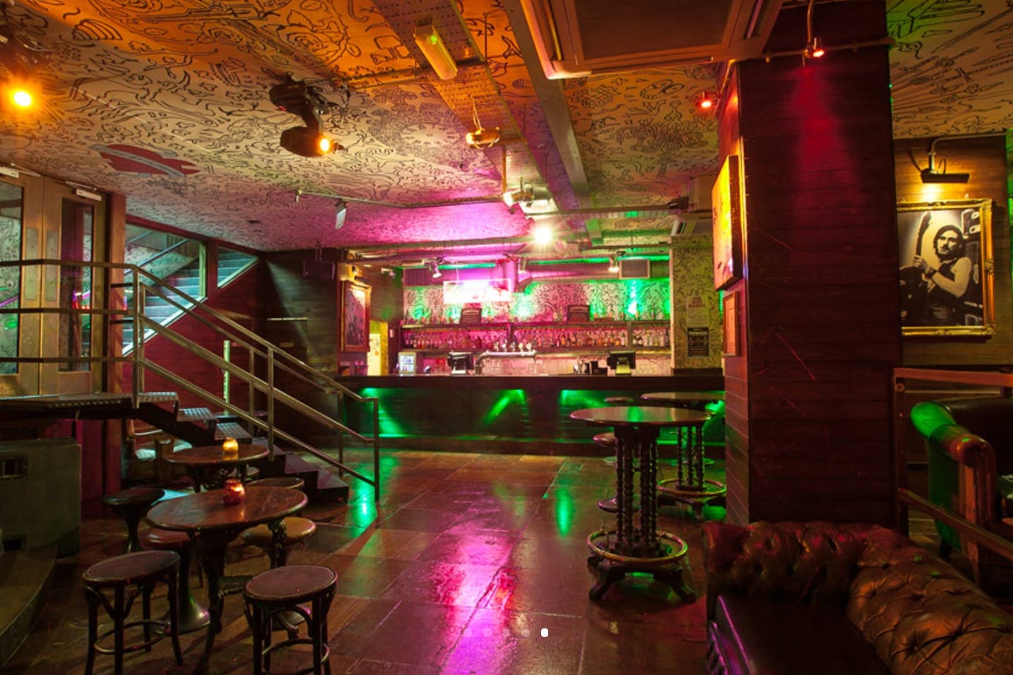 Vibrant Hoxton Underbelly event space with colorful lighting for social gatherings.