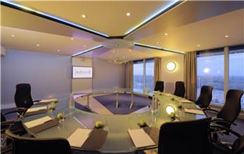 Modern conference room in Radisson Blu Manchester Airport, ideal for meetings and briefings.