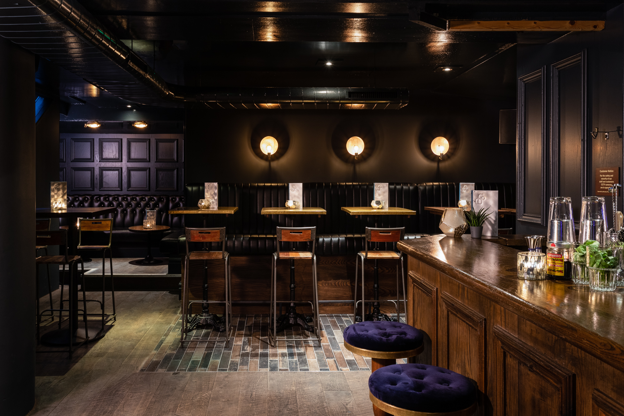 Intimate Foundry Project venue with dark wood accents for small meetings and events.