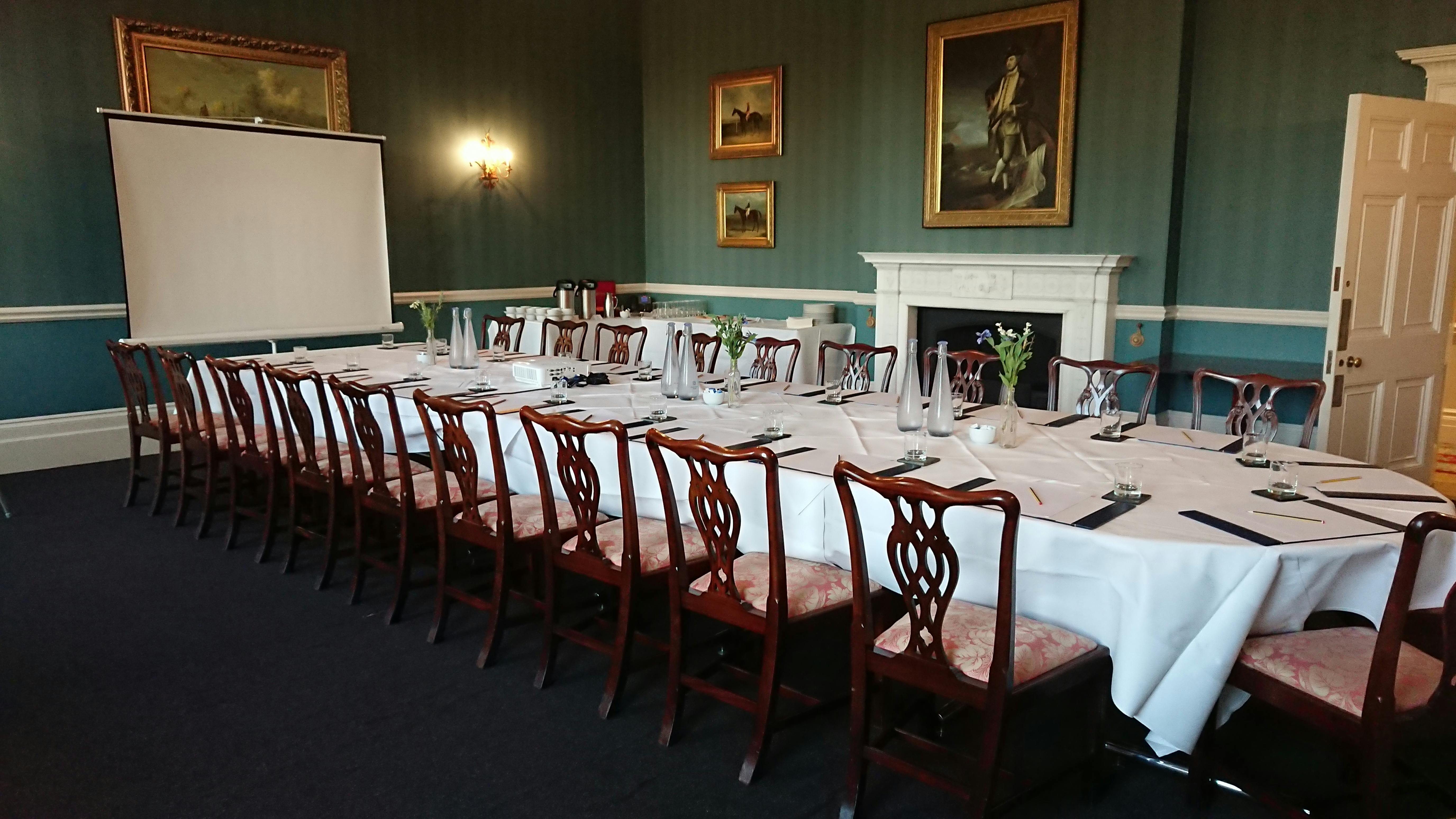 Billiards Room at Hartham Park, elegant table setup for formal meetings and events.