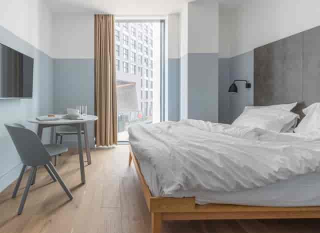Modern hotel room at Leman Locke, ideal for business events and meetings.