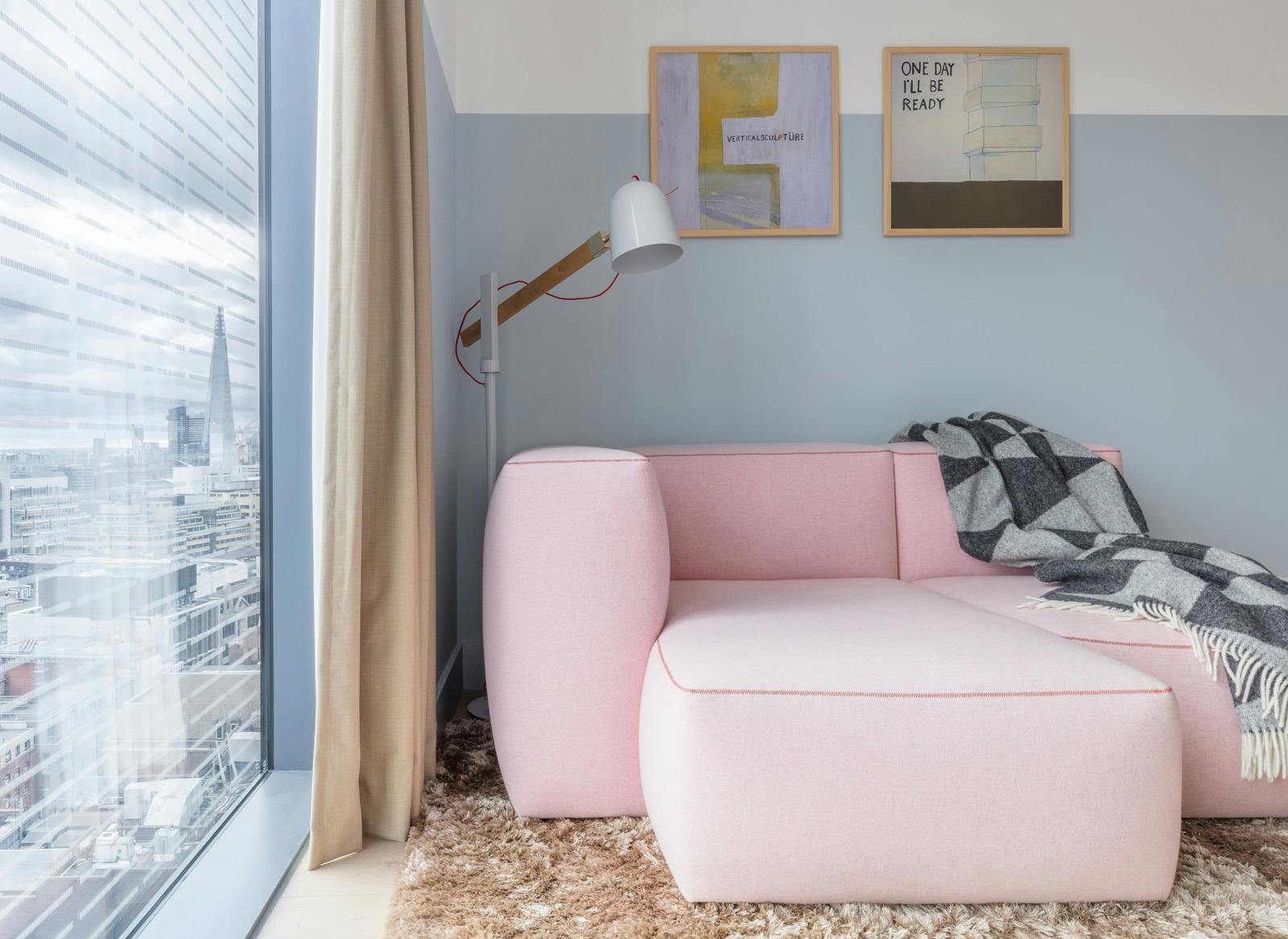 Modern lounge at Leman Locke with pink couch, ideal for networking and meetings.