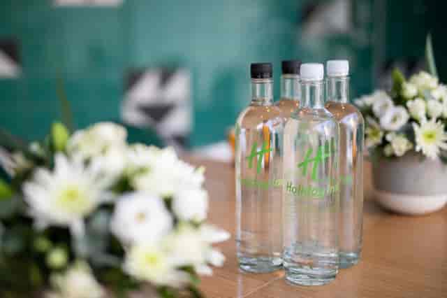 Green Room at Holiday Inn London Whitechapel with floral arrangements for meetings.