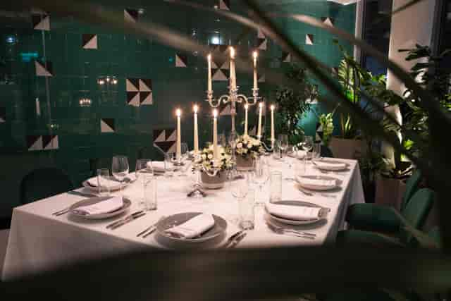 Elegant dining table in Green Room, Holiday Inn London Whitechapel for upscale events.