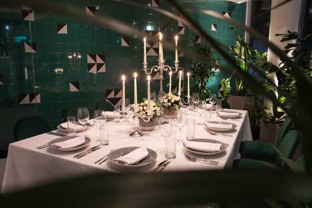 Elegant dining table in Green Room, Holiday Inn London Whitechapel for upscale events.