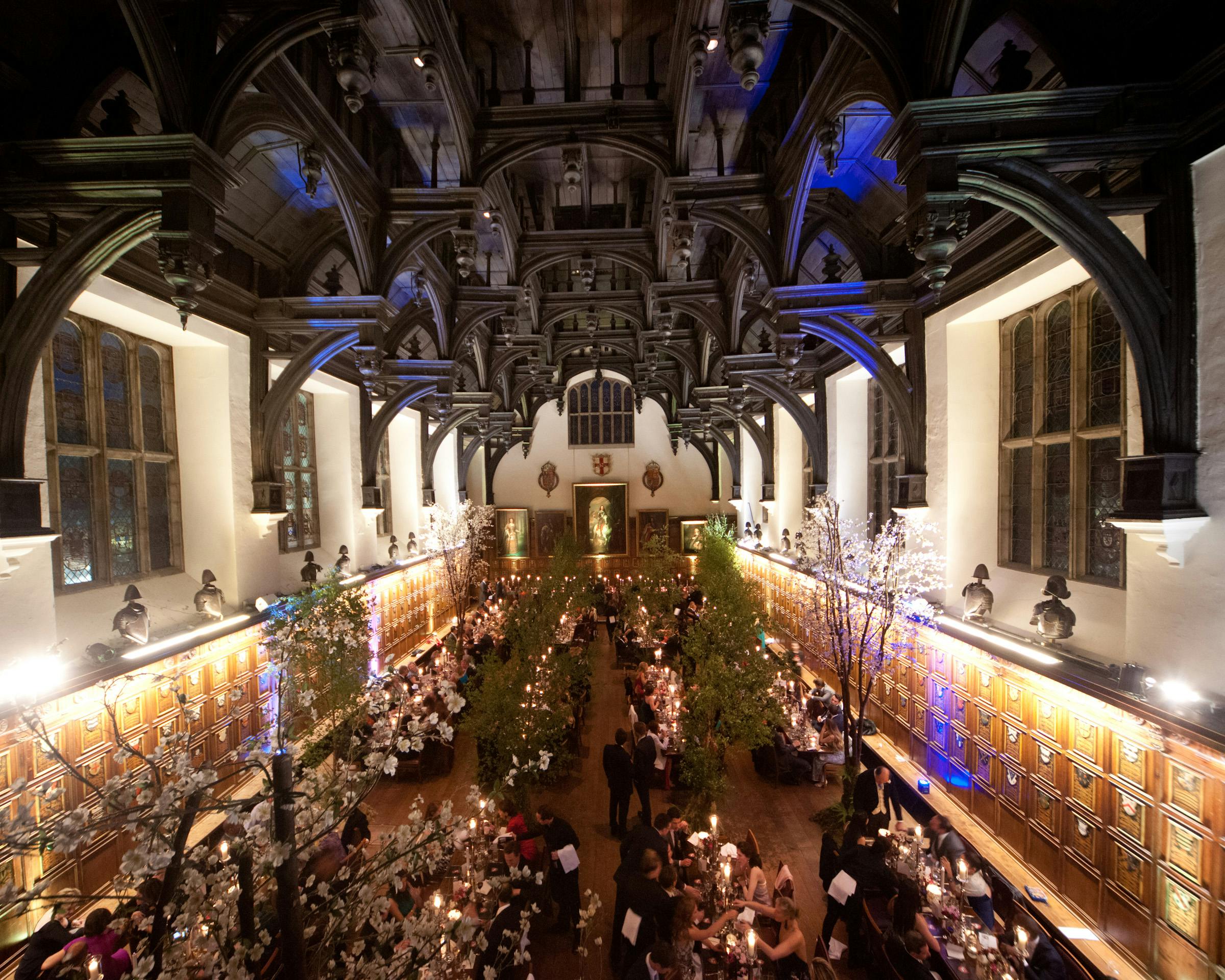 Elegant Elizabethan Hall banquet setup with floral centerpieces for weddings and galas.