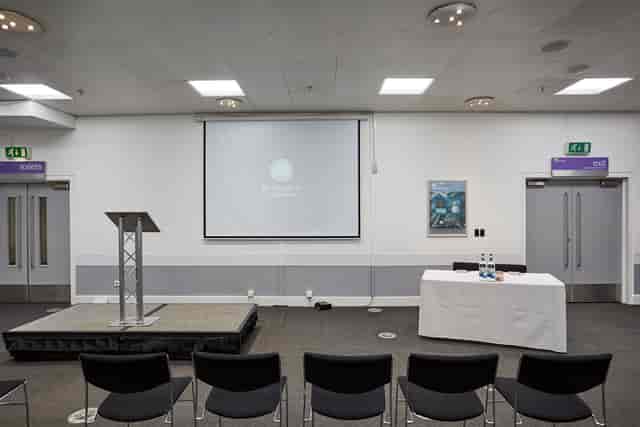 Event Suite at Thinktank: organized meeting space with podium, ideal for conferences and workshops.