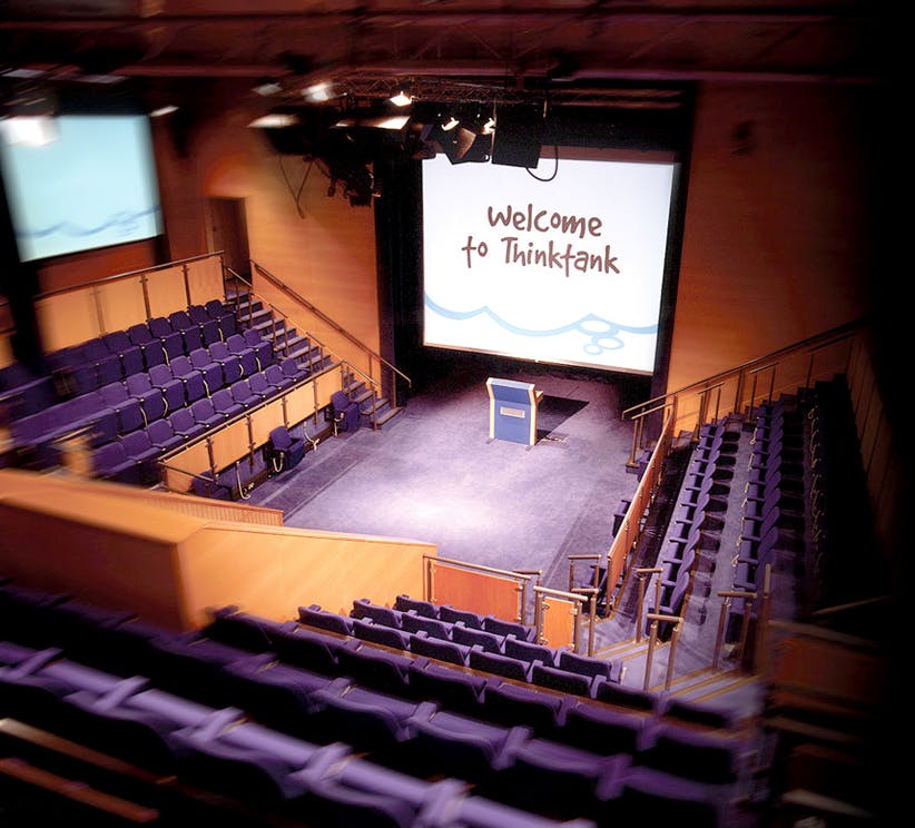 Thinktank Theatre auditorium set for events with spacious seating and welcoming backdrop.