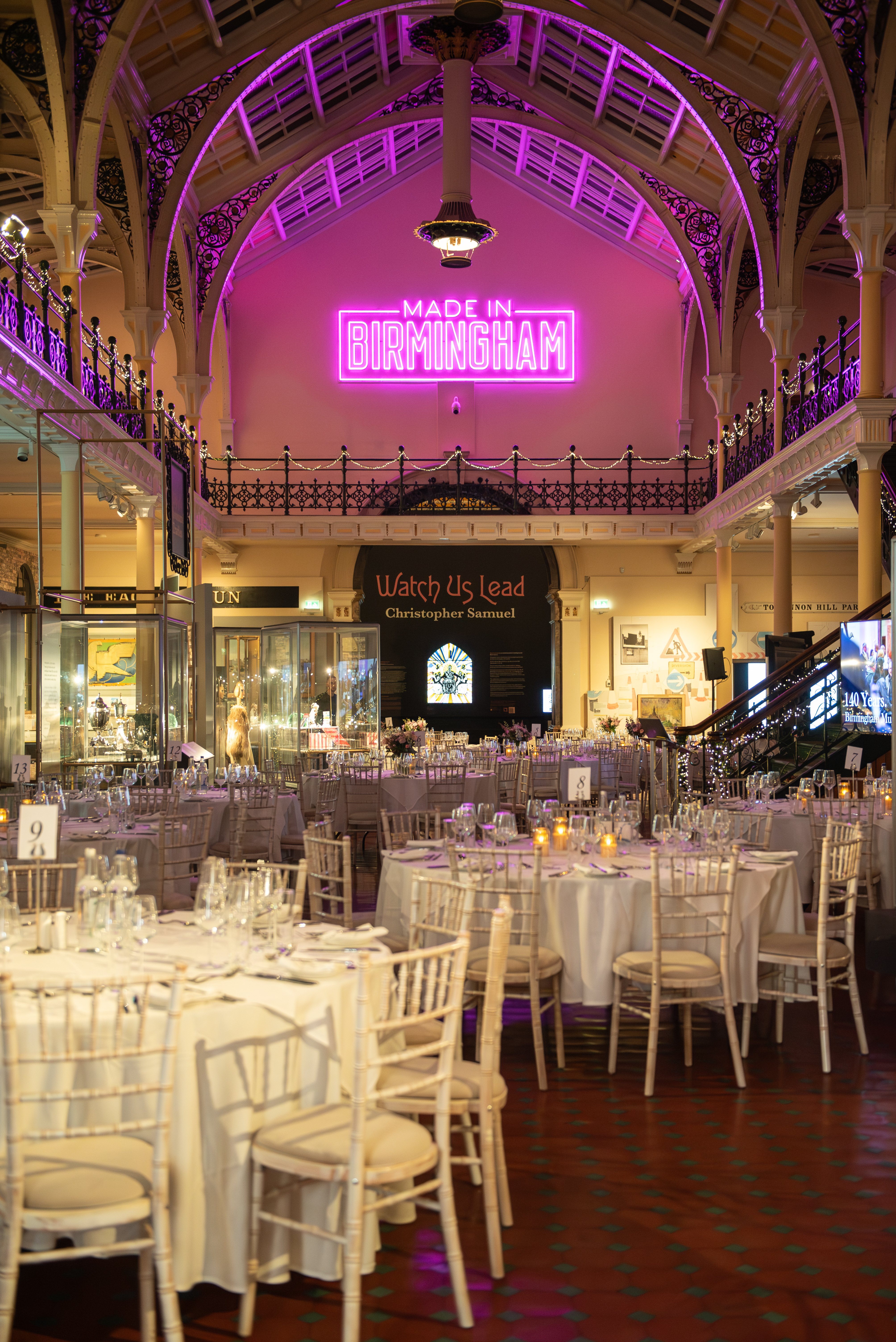 Elegant event space with round tables, ideal for weddings and corporate events.