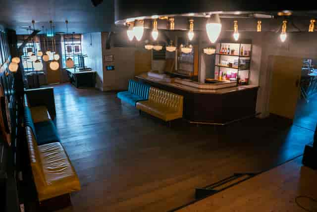 Stylish event space at Tigers Lounge with modern bar and inviting atmosphere for gatherings.