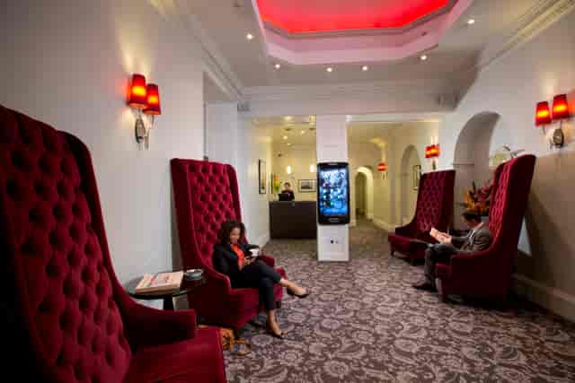 Stylish lobby with plush chairs at Thistle Bloomsbury Park, ideal for networking events.