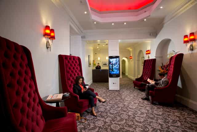 Stylish lobby with plush chairs at Thistle Bloomsbury Park, ideal for networking events.