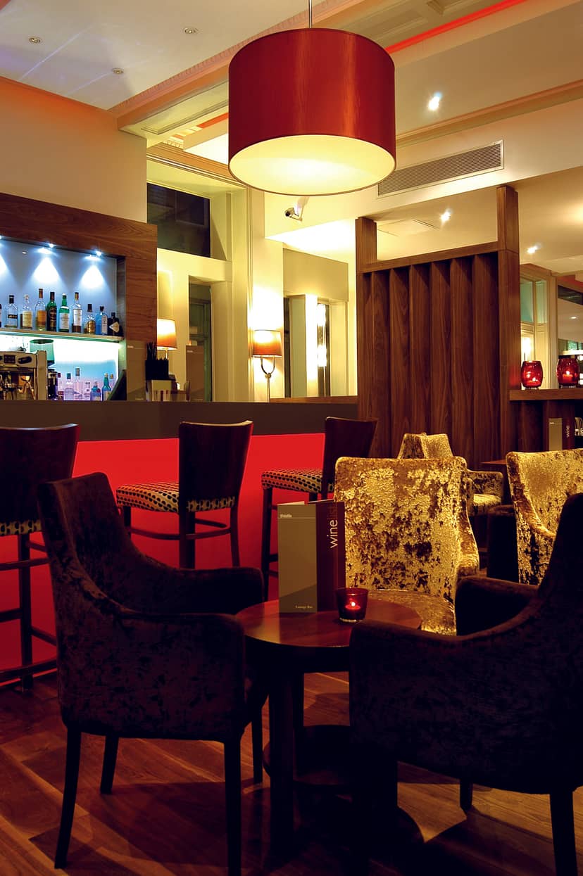 Stylish lounge area in Thistle Bloomsbury Park for networking events and meetings.