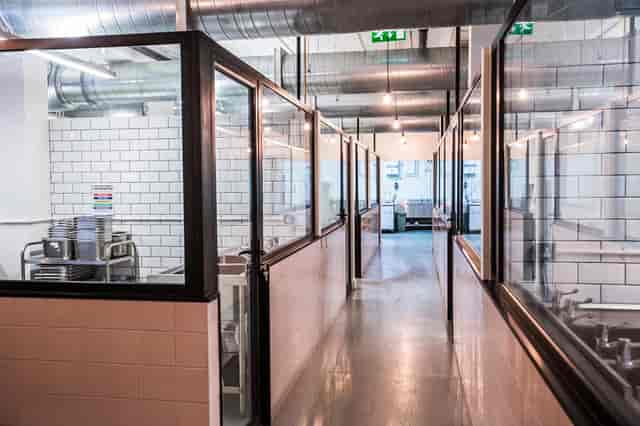 Industrial breakout area in Karma Kitchen for coworking events and catering logistics.