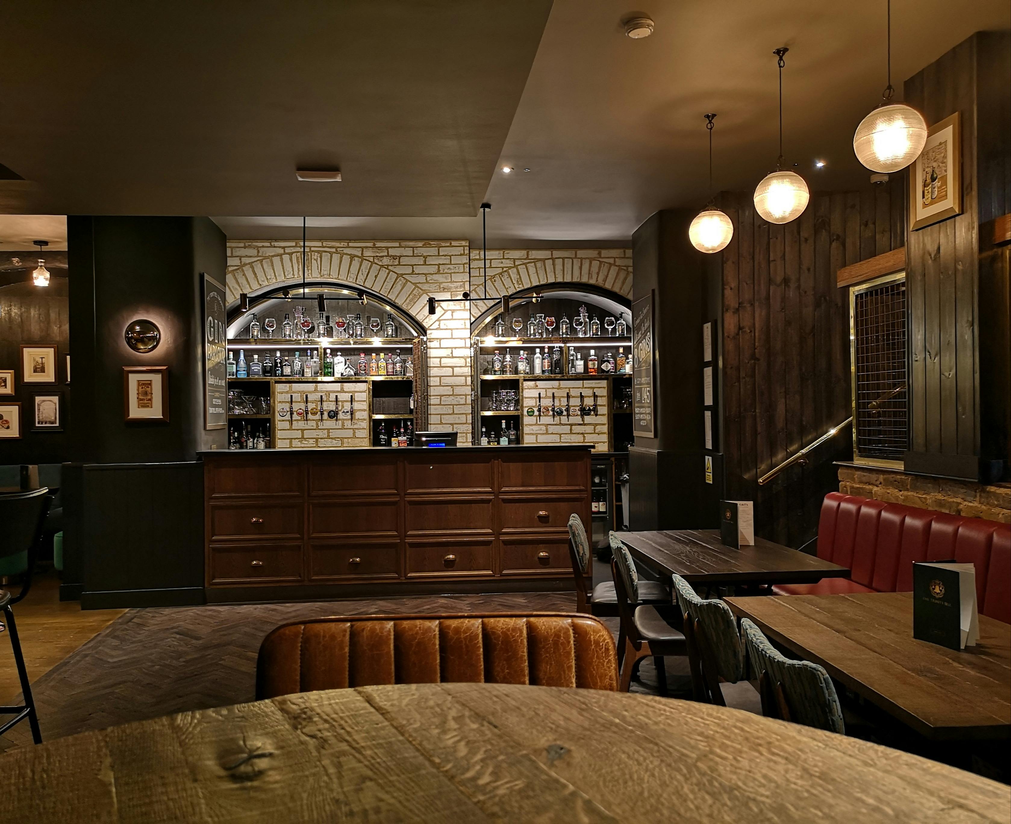 Stylish Gin Bar at The Trinity Bell, cozy ambiance for gatherings and networking events.