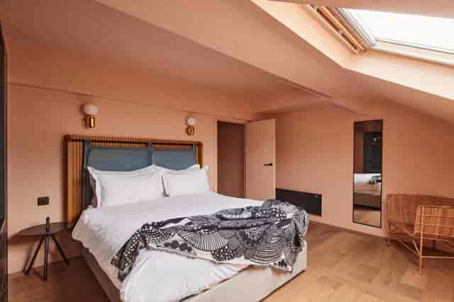 Stylish hotel room at The Storehouse, perfect for intimate meetings and retreats.