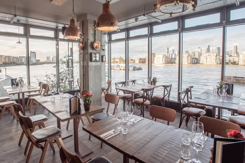 Stylish restaurant with waterfront view, ideal for events and gatherings.