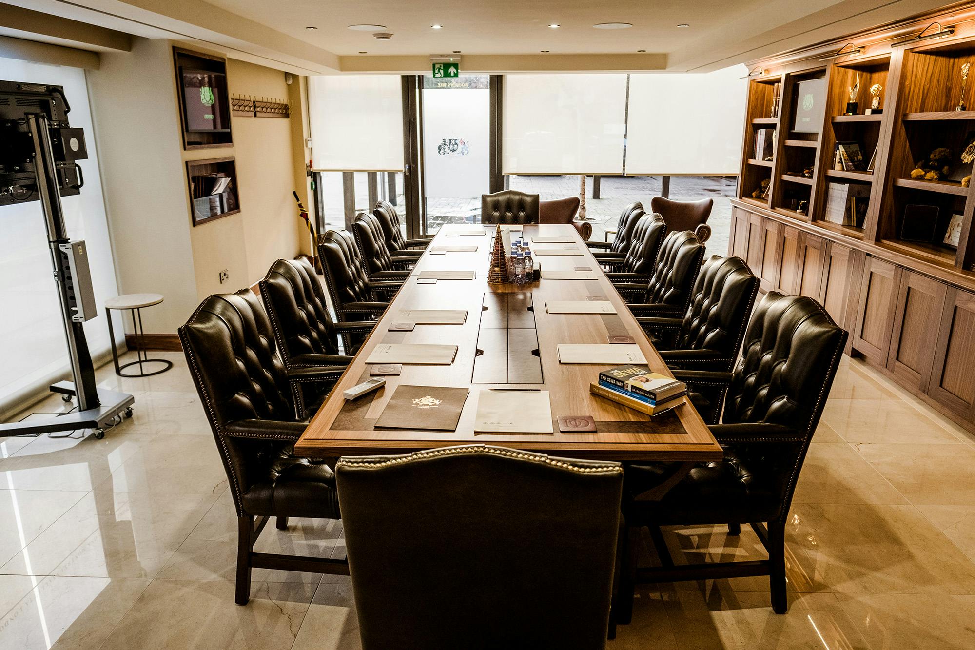 Boardroom in Oxford with polished table, ideal for meetings and executive retreats.