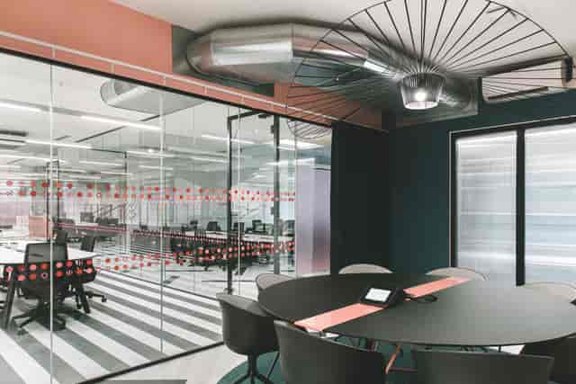 Modern meeting space with glass walls for creative collaboration in Huckletree Ancoats.