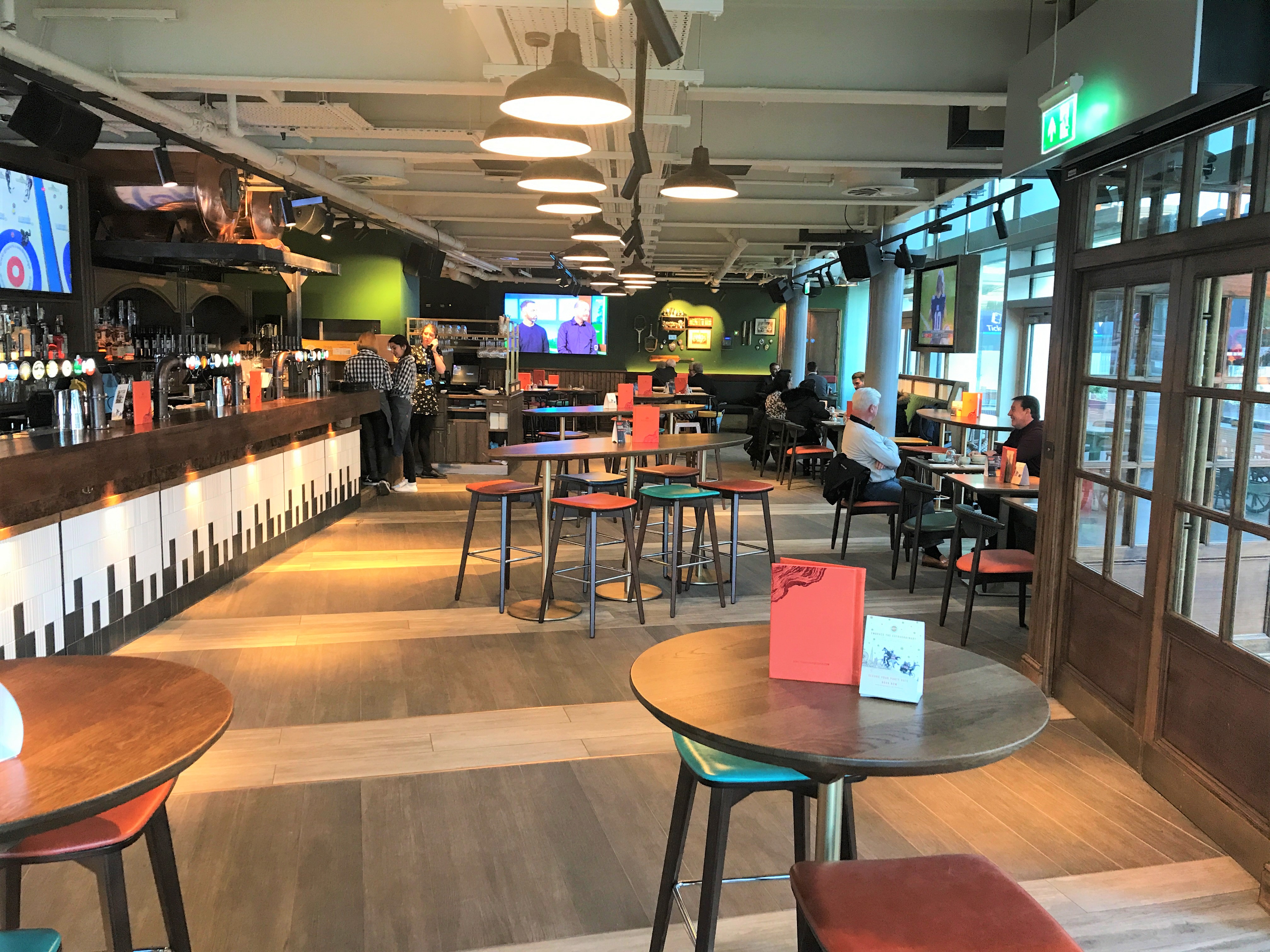 Full venue hire at Redwood Sports Pub, featuring a modern bar for networking events. - Banner
